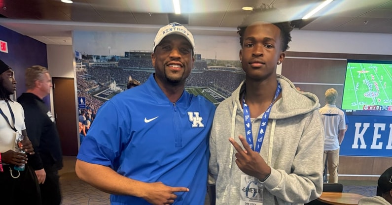Dre Otey with Kentucky defensive backs coach Chris Collins (Photo provided by Dre Otey)