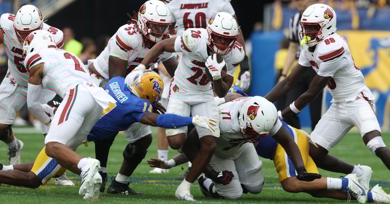 Sep 27, 2025; Pittsburgh, Pennsylvania, USA; Louisville Cardinals running back Duke Watson (26) runs the ball against the Pittsburgh Panthers during the second quarter at Acrisure Stadium. Mandatory Credit: Charles LeClaire-Imagn Images