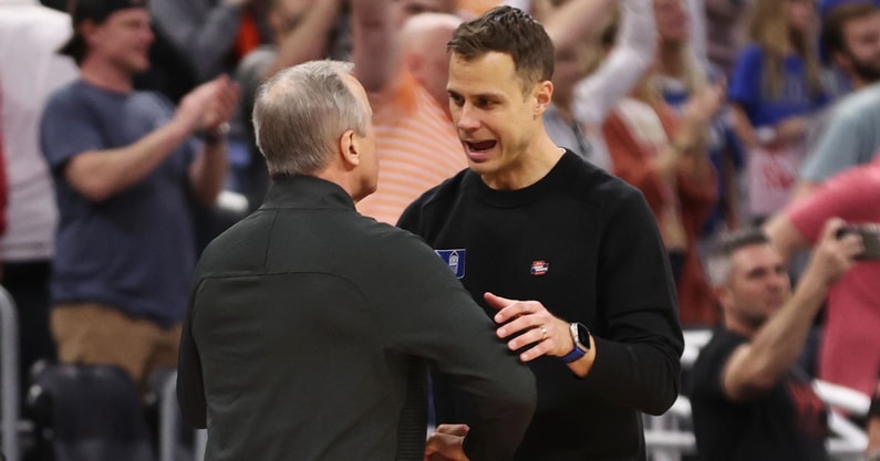 Mar 18, 2023; Orlando, FL, USA; Duke Blue Devils head coach Jon Scheyer (right) greets Tennessee Volunteers head coach Rick Barnes (left) after the second round of the 2023 NCAA Tournament at Legacy Arena. Mandatory Credit: Matt Pendleton-USA TODAY Sports