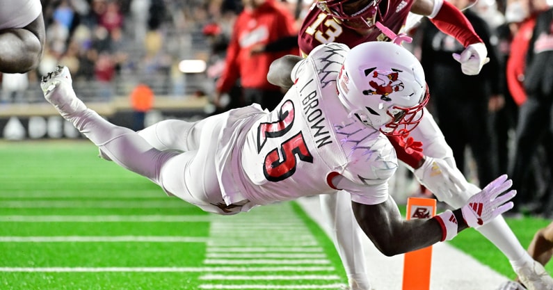 Oct 25, 2024; Chestnut Hill, Massachusetts, USA; Louisville Cardinals running back Isaac Brown (25) dives for a touchdown against the Boston College Eagles during the first half at Alumni Stadium. Mandatory Credit: Eric Canha-Imagn Images
