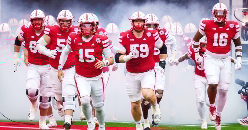 Nebraska football OL Teddy Prochazka (65), OL Rocco Spindler (50), QB Dylan Raiola (15), OL Henry Lutovsky (59) and DL Elijah Jeudy ahead of the Huskers' 28-21 win over Northwestern