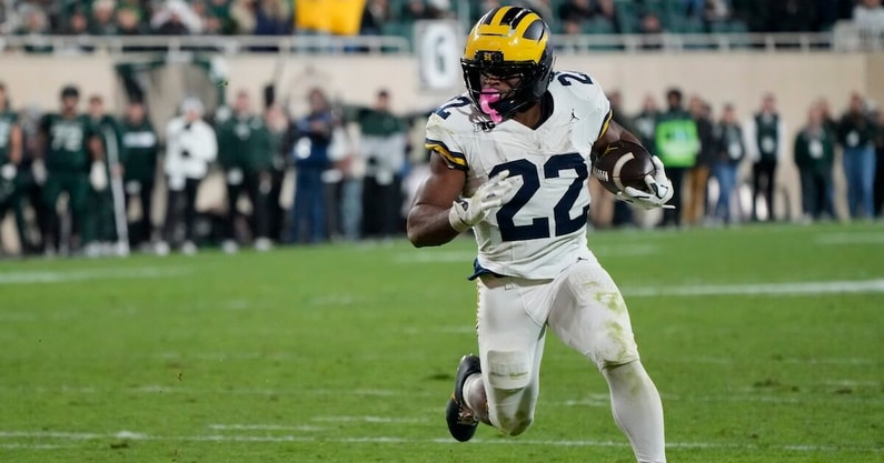 Oct 25, 2025; East Lansing, Michigan, USA; Michigan Wolverines running back Justice Haynes (22) carries the ball for a touchdown against the Michigan State Spartans during the second half at Spartan Stadium. Mandatory Credit: Brendan Mullin-Imagn Images