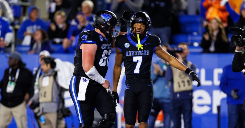 Oct 25, 2025; Lexington, Kentucky, USA; Kentucky Wildcats offensive lineman Jager Burton (62) celebrates with wide receiver DJ Miller (7) after Miller scores a touchdown during the third quarter against the Tennessee Volunteers at Kroger Field. Mandatory Credit: Jordan Prather-Imagn Images