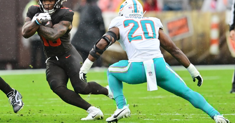 Oct 19, 2025; Cleveland, Ohio, USA; Cleveland Browns running back Quinshon Judkins (10) runs with the ball against Miami Dolphins linebacker Jordyn Brooks (20) during the first quarter at Huntington Bank Field.