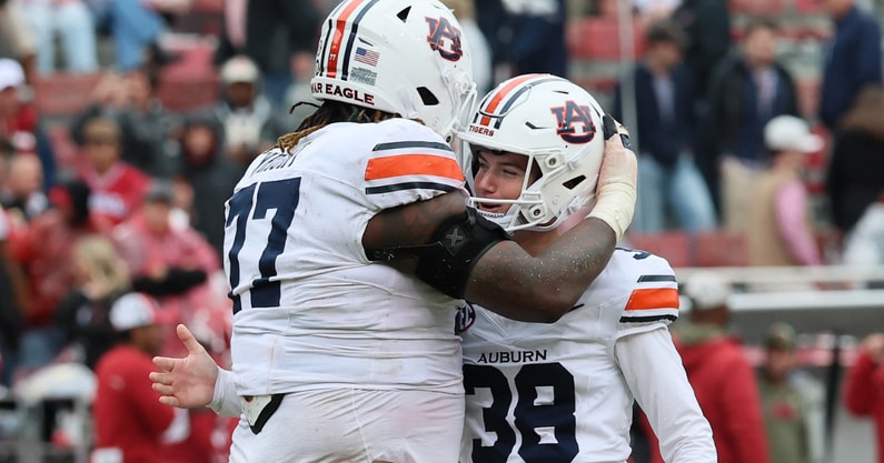 Jeremiah Wright and Alex McPherson celebrate during Auburn's win at Arkansas. (Photo by USA Today)