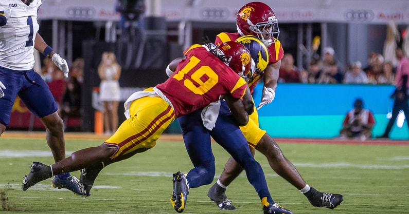 USC safety Bishop Fitzgerald makes a tackle against the Michigan Wolverines