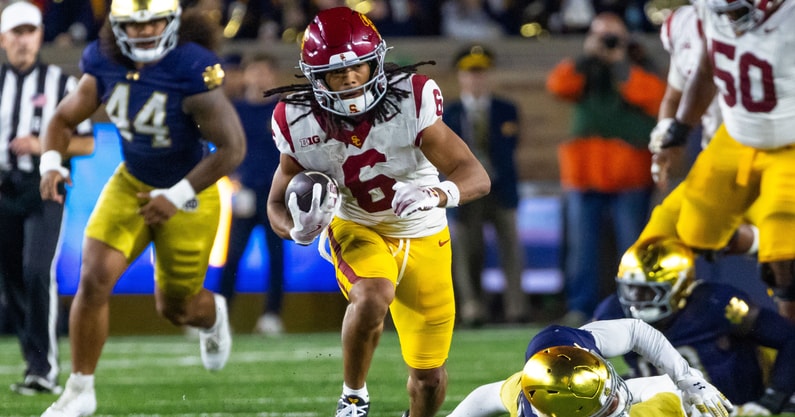 USC Trojans wide receiver Makai Lemon (6) breaks a tackle by Notre Dame Fighting Irish cornerback Leonard Moore (15) during the first half at Notre Dame Stadium