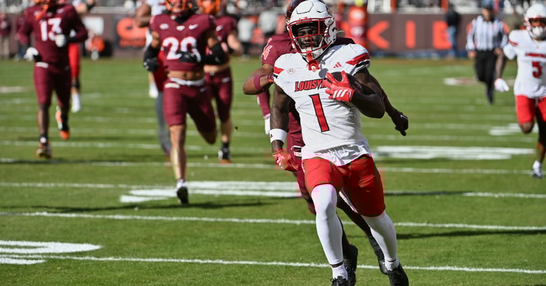 Nov 1, 2025; Blacksburg, Virginia, USA; Louisville Cardinals running back Isaac Brown (1) runs the ball for a touchdown against the Virginia Tech Hokies during the first quarter at Lane Stadium. Mandatory Credit: Brian Bishop-Imagn Images