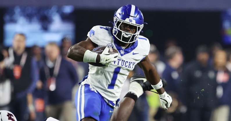 Nov 1, 2025; Auburn, Alabama, USA; Kentucky Wildcats wide receiver Kendrick Law (1) escapes the tackle of Auburn Tigers linebacker Bryce Deas (16) during the fourth quarter at Jordan-Hare Stadium. Mandatory Credit: John Reed-Imagn Images