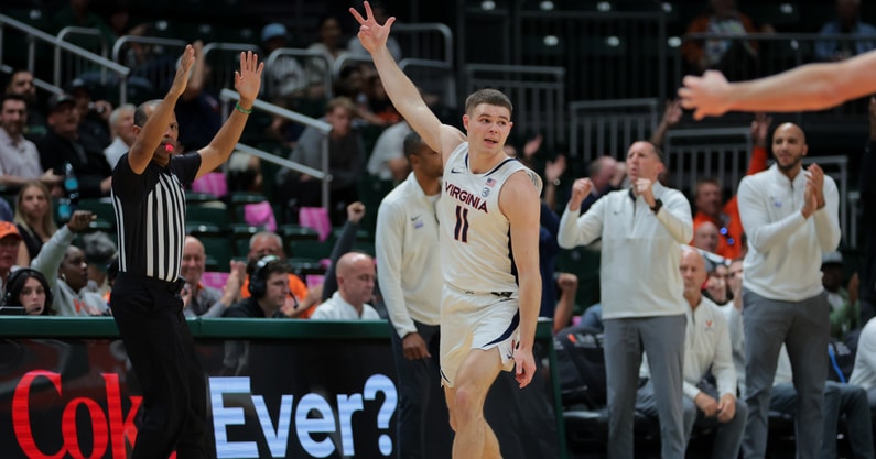 Jan 29, 2025; Coral Gables, Florida, USA; Virginia Cavaliers guard Isaac McKneely (11) reacts after scoring against the Miami Hurricanes during the second half at Watsco Center. Mandatory Credit: Sam Navarro-Imagn Images