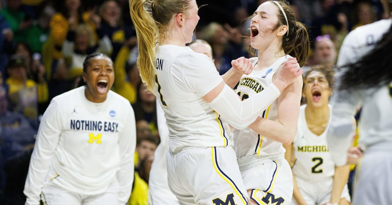 Syla Swords and Olivia Olson celebrate a play