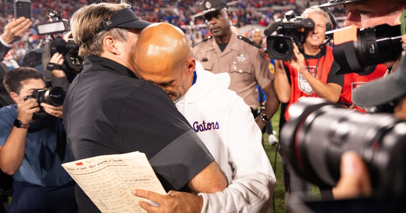 Florida interim head coach Billy Gonzales embraces Kirby Smart after a close loss to Georgia, via © Doug Engle:Florida Times-Union : USA TODAY NETWORK via Imagn Images