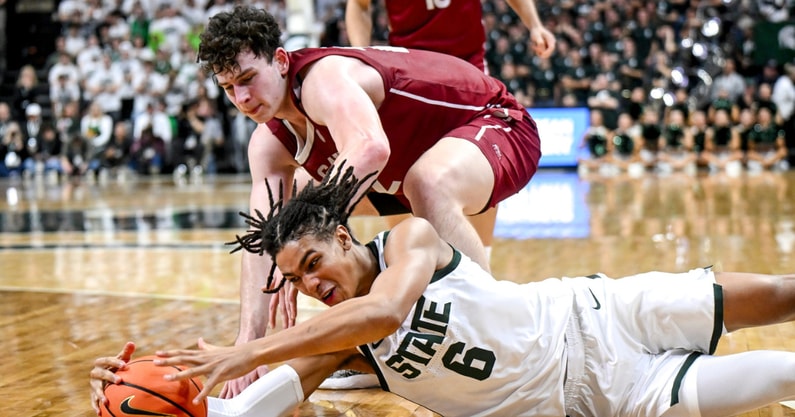 Michigan State's Jordan Scott, below, battles Colgate's Andrew Alekseyenko for the ball during the second half on Monday, Nov. 3, 2025, at the Breslin Center in East Lansing. - Nick King, USA TODAY Sports