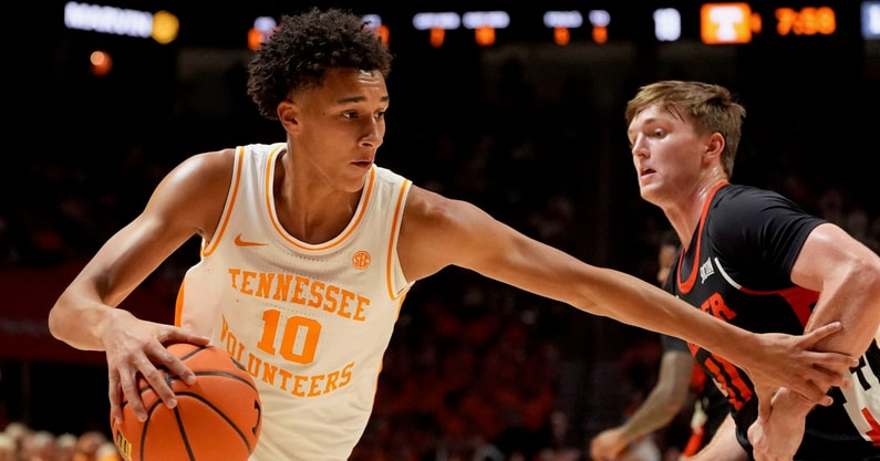 Saul Young/News Sentinel / USA TODAY NETWORK via Imagn Images | Tennessee forward Nate Ament (10) tries to the basket while guarded by Mercer guard Brady Shoulders (11) in an NCAA college basketball game on November 3, 2025, in Knoxville, Tenn.