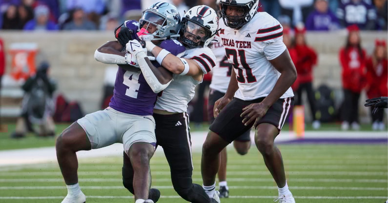 Nov 1, 2025; Manhattan, Kansas, USA; Kansas State Wildcats running back Joe Jackson (4) is tackled by Texas Tech Red Raiders linebacker John Curry (6) as linebacker David Bailey (31) watches the play during the fourth quarter at Bill Snyder Family Football Stadium.