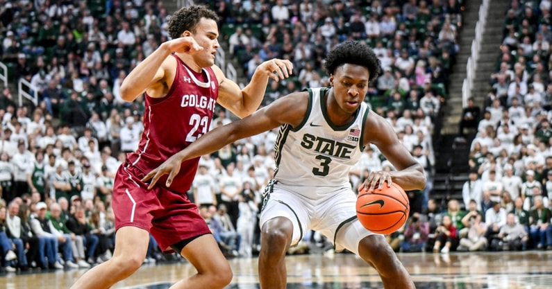 Michigan State's Cam Ward, right, moves the ball as Colgate's Cooper Wright defends during the first half on Monday, Nov. 3, 2025, at the Breslin Center in East Lansing. - Nick King, USA TODAY Sports