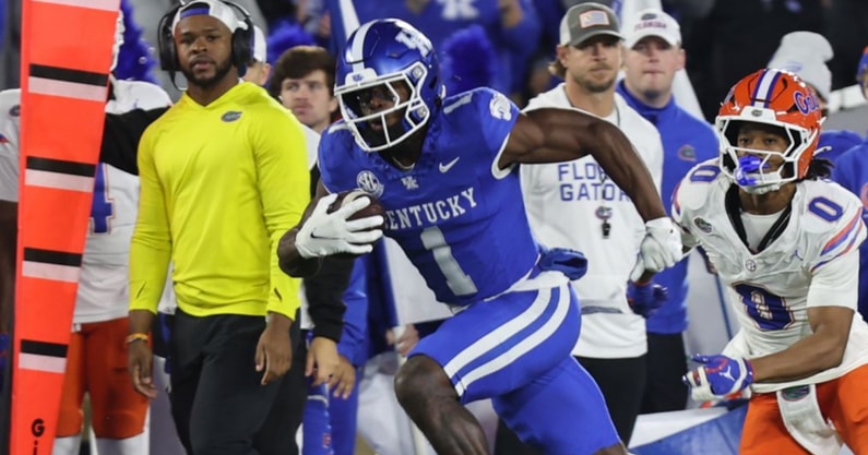Kentucky WR Kendrick Law runs past a Florida defender at Kroger Field, Dr. Michael Huang, KSR