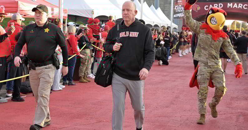 Nov 8, 2025; Louisville, Kentucky, USA; Louisville Cardinals head coach Jeff Brohm greets fans during the Card March before facing off against the California Golden Bears at L&N Federal Credit Union Stadium. Mandatory Credit: Jamie Rhodes-Imagn Images