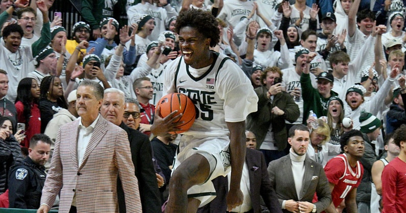 Michigan State Spartans forward Coen Carr (55) leaps down the court with the ball after the final buzzer and The Spartans beat Arkansas 69-66 at Jack Breslin Student Events Center. - Dale Young, USA TODAY Sports