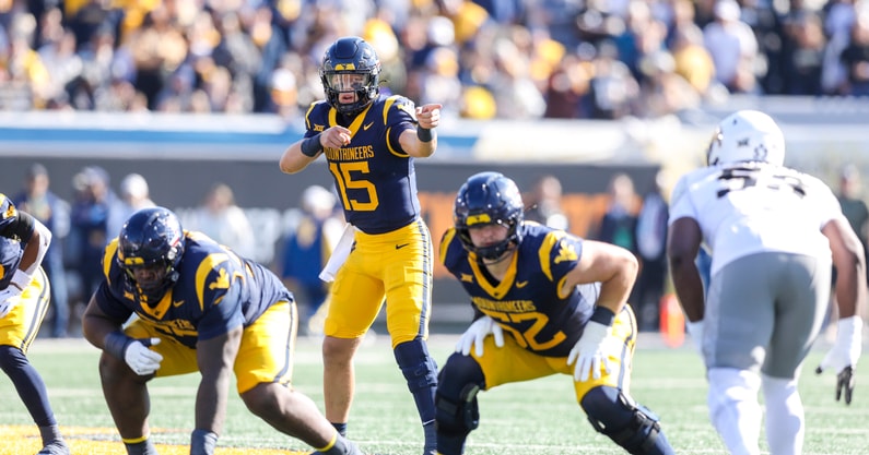 West Virginia Mountaineers quarterback Scotty Fox Jr. (15) changes the play at the line of scrimmage during the first quarter against the Colorado Buffaloes at Milan Puskar Stadium. Credit: Ben Queen-Imagn Images