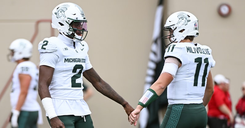 Michigan State Spartans quarterback Aidan Chiles (2) fist pumps Michigan State Spartans quarterback Alessio Milivojevic (11) prior to the game against the Indiana Hoosiers at Memorial Stadium. - Robert Goddin, USA TODAY Sports