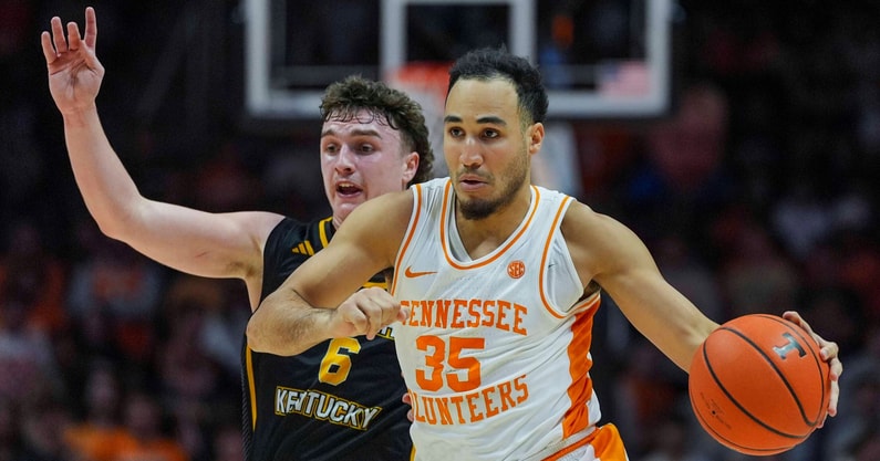 Angelina Alcantar/News Sentinel / USA TODAY NETWORK via Imagn Images | Tennessee guard Ethan Burg (35) dribbles past Northern Kentucky guard Ethan Elliott (6) during a NCAA basketball game between the Tennessee Volunteers and Northern Kentucky Norse at Thompson-Boling Arena at Food City Center on Nov. 8, 2025.
