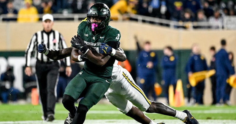 Michigan State's Elijah Tau-Tolliver runs for a gain against Michigan during the fourth quarter on Saturday, Oct. 25, 2025, at Spartan Stadium in East Lansing. - Nick King, USA TODAY Sports
