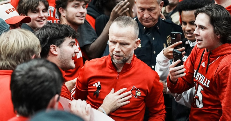 Louisville Cardinals head coach Pat Kelsey went into the Cardinal student section to thank the fans for their support after the Cards beat the Cats 96-88 in the UofL-UK annual rivalry game at the KFC Yum! Center in Louisville, Kentucky Nov. 11, 2025.