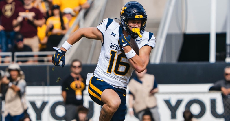 West Virginia wide receiver Jeff Weimer scores on the 75-yard pass from Scotty Fox.
