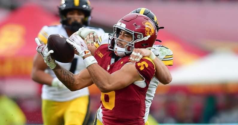 USC Trojans wide receiver Makai Lemon (6) catches a pass against the defense of Iowa Hawkeyes defensive back Zach Lutmer (6) during the second half at the Los Angeles Memorial Coliseum