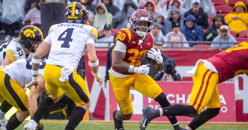 USC Trojans running back King Miller runs the ball against the Iowa Hawkeyes