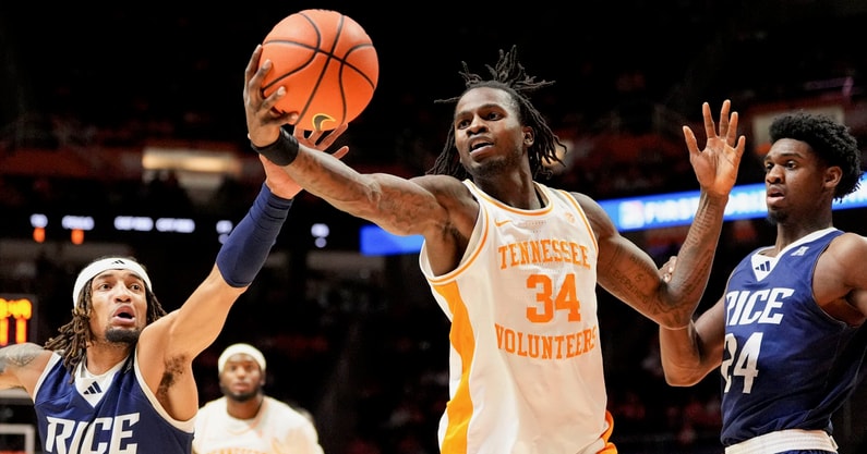 Saul Young/News Sentinel / USA TODAY NETWORK via Imagn Images | Tennessee forward Felix Okpara (34) and Rice guard/forward Nick Anderson (23) go after the rebound during an NCAA college basketball game on November 17, 2025, in Knoxville, Tenn.
