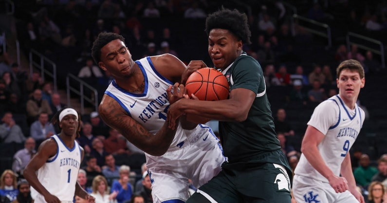 Nov 18, 2025; New York, New York, USA; Kentucky Wildcats forward Brandon Garrison (10) and Michigan State Spartans forward Cameron Ward (3) battle for a rebound during the first half at Madison Square Garden. Mandatory Credit: Vincent Carchietta-Imagn Images