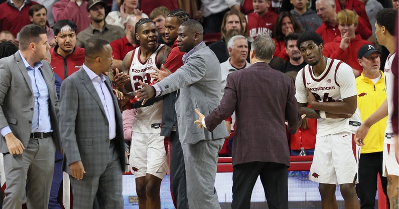 John Calipari had to restrain Arkansas forward Nick Pringle at the end of a nail-biting win over Winthrop, via Nelson Chenault-Imagn Images