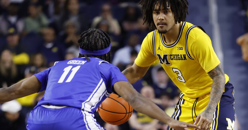 Nov 19, 2025; Ann Arbor, Michigan, USA; Michigan Wolverines guard Elliot Cadeau (3) dribbles defended by Middle Tennessee Blue Raiders guard Tre Green (11) in the first half at Crisler Center. Mandatory Credit: Rick Osentoski-Imagn Images