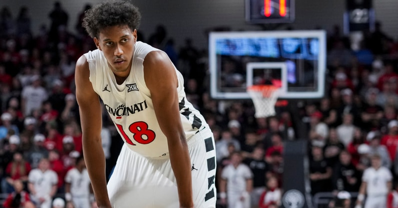 Nov 11, 2025; Cincinnati, Ohio, USA; Cincinnati Bearcats forward Baba Miller (18) stands on the court against the Dayton Flyers in the second half at Fifth Third Arena. Mandatory Credit: Aaron Doster-Imagn Images