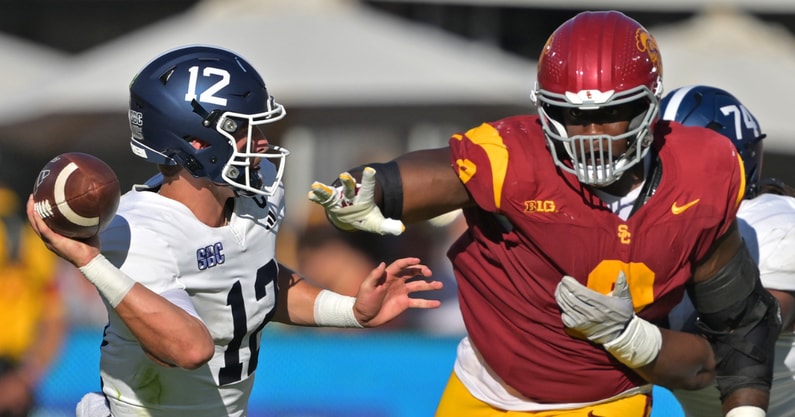 Georgia Southern Eagles quarterback JC French IV (12) is pressured by USC Trojans defensive tackle Keeshawn Silver (9) during the first half at United Airlines Field at the Los Angeles Memorial Coliseum