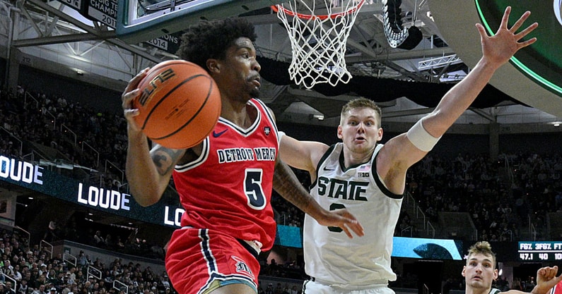 Michigan State Spartans forward Jaxon Kohler (0) defends Detroit Mercy Titans guard Orlando Lovejoy (5) during the first half at Jack Breslin Student Events Center. - Dale Young, USA TODAY Sports