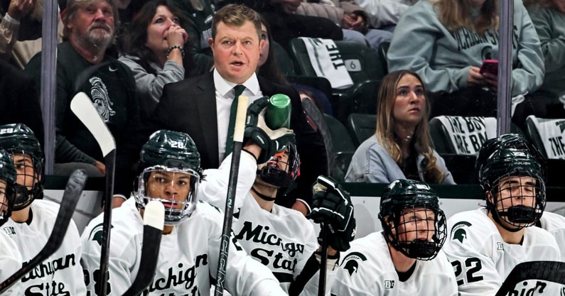 Michigan State's head coach Adam Nightingale, center, looks on from the bench during the first period in the game against New Hampshire on Thursday, Oct. 9, 2025, at Munn Ice Arena in East Lansing. - Nick King, USA TODAY Sports