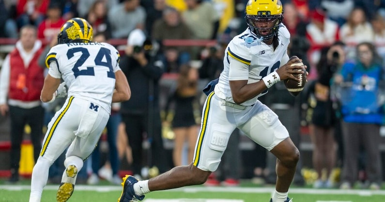 Nov 22, 2025; College Park, Maryland, USA; Michigan Wolverines quarterback Bryce Underwood (19) rolls out to pass during the ]first half against the Maryland Terrapins at SECU Stadium. Mandatory Credit: Tommy Gilligan-Imagn Images
