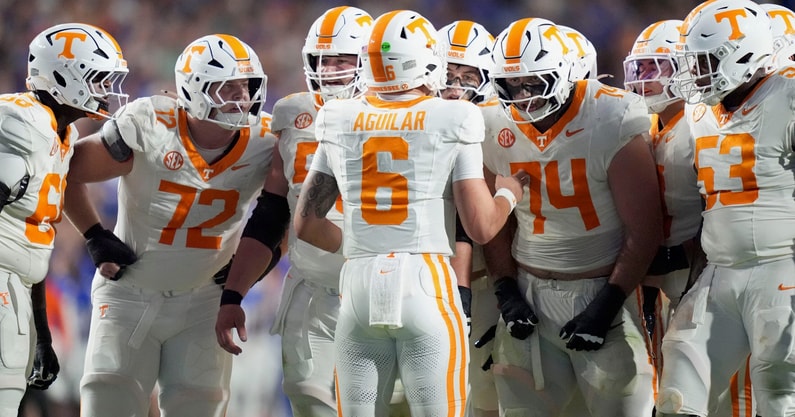 Tennessee quarterback Joey Aguilar (6) huddles with the offensive line during an NCAA college football game against Florida on November 22, 2025, in Gainesville, Florida.
