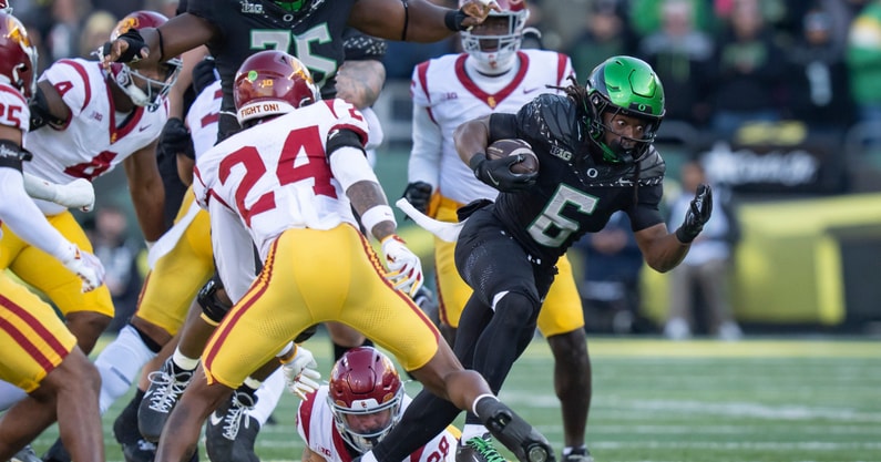 Oregon running back Noah Whittington carries the ball as the Oregon Ducks host the USC Trojans on Nov. 22, 2025, at Autzen Stadium in Eugene, Oregon