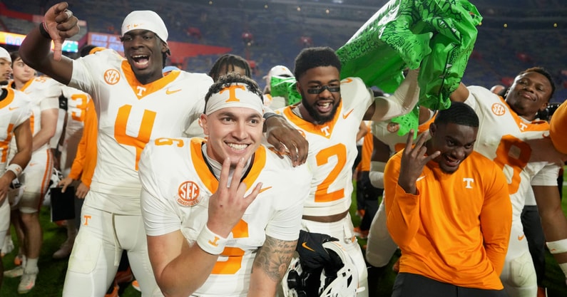 Tennessee quarterback Joey Aguilar (6), along with and defensive backs Ty Redmond (4) and Andre Turrentine (2), celebrate the win over Florida in an NCAA college football game on November 22, 2025, in Gainesville, Florida.