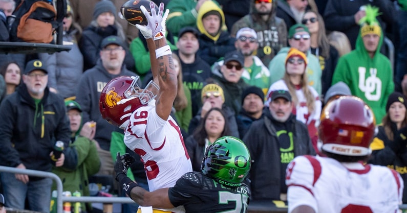 USC wide receiver Tanook Hines hauls in a touchdown pass under cover from Oregon defensive back Aaron Flowers as the Oregon Ducks host the USC Trojans on Nov. 22, 2025, at Autzen Stadium in Eugene, Oregon