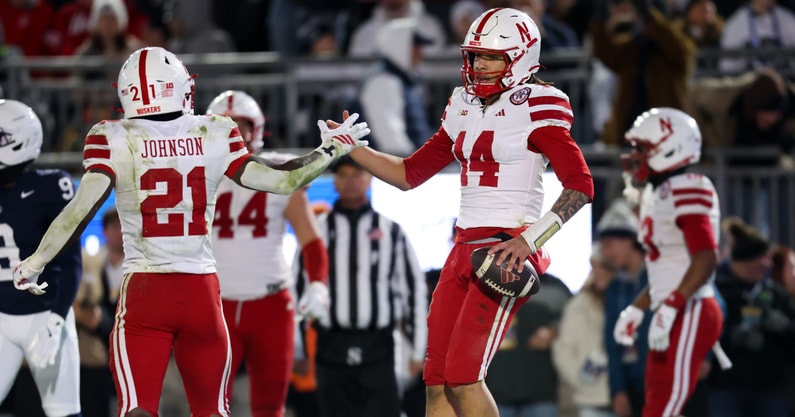 Nebraska football QB TJ Lateef (14) and RB Emmett Johnson (21) against Penn State