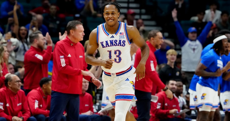Nov 24, 2025; Las Vegas, Nevada, USA; Kansas Jayhawks guard Elmarko Jackson (13) reacts after a made basket against the Notre Dame Fighting Irish during the second half in a 2025 Players Era Festival group play game at MGM Grand Garden Arena. Mandatory Credit: Stephen R. Sylvanie-Imagn Images