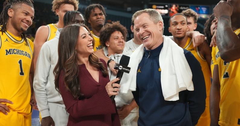 Nov 25, 2025; Las Vegas, NV, USA; TNT Sports reporter Lauren Jbara (left) interviews Michigan Wolverines head coach Dusty May after a 2025 Players Era Festival group play game against the Auburn Tigers at Michelob ULTRA Arena. Mandatory Credit: Kirby Lee-Imagn Images