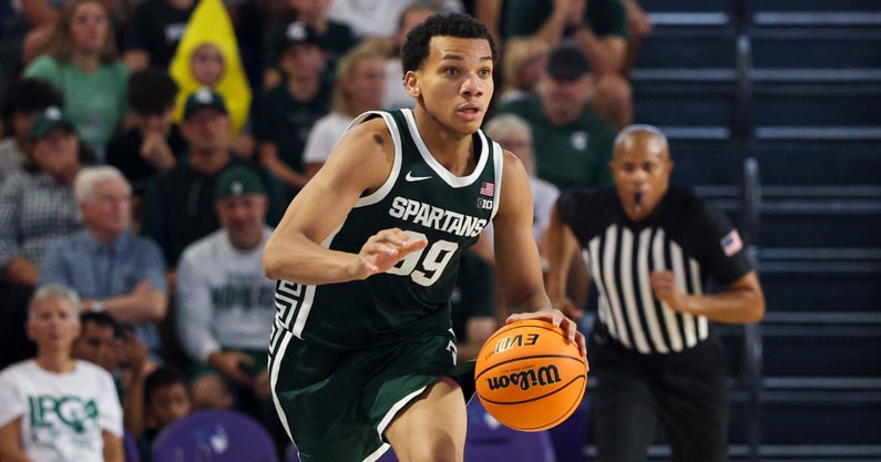 Michigan State Spartans guard Divine Ugochukwu (99) controls the ball against the East Carolina Pirates in the second half at Suncoast Credit Union Arena. - Nathan Ray Seebeck, USA TODAY Sports