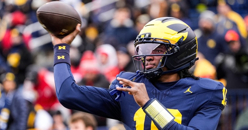 Michigan quarterback Bryce Underwood (19) warms up at Michigan Stadium in Ann Arbor on Saturday, Nov. 29, 2025.