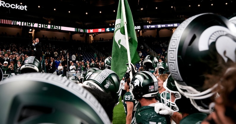 Michigan State players sing the Michigan State fight song after defeating Maryland at Ford Field. - Brendan Mullin, USA TODAY Sports